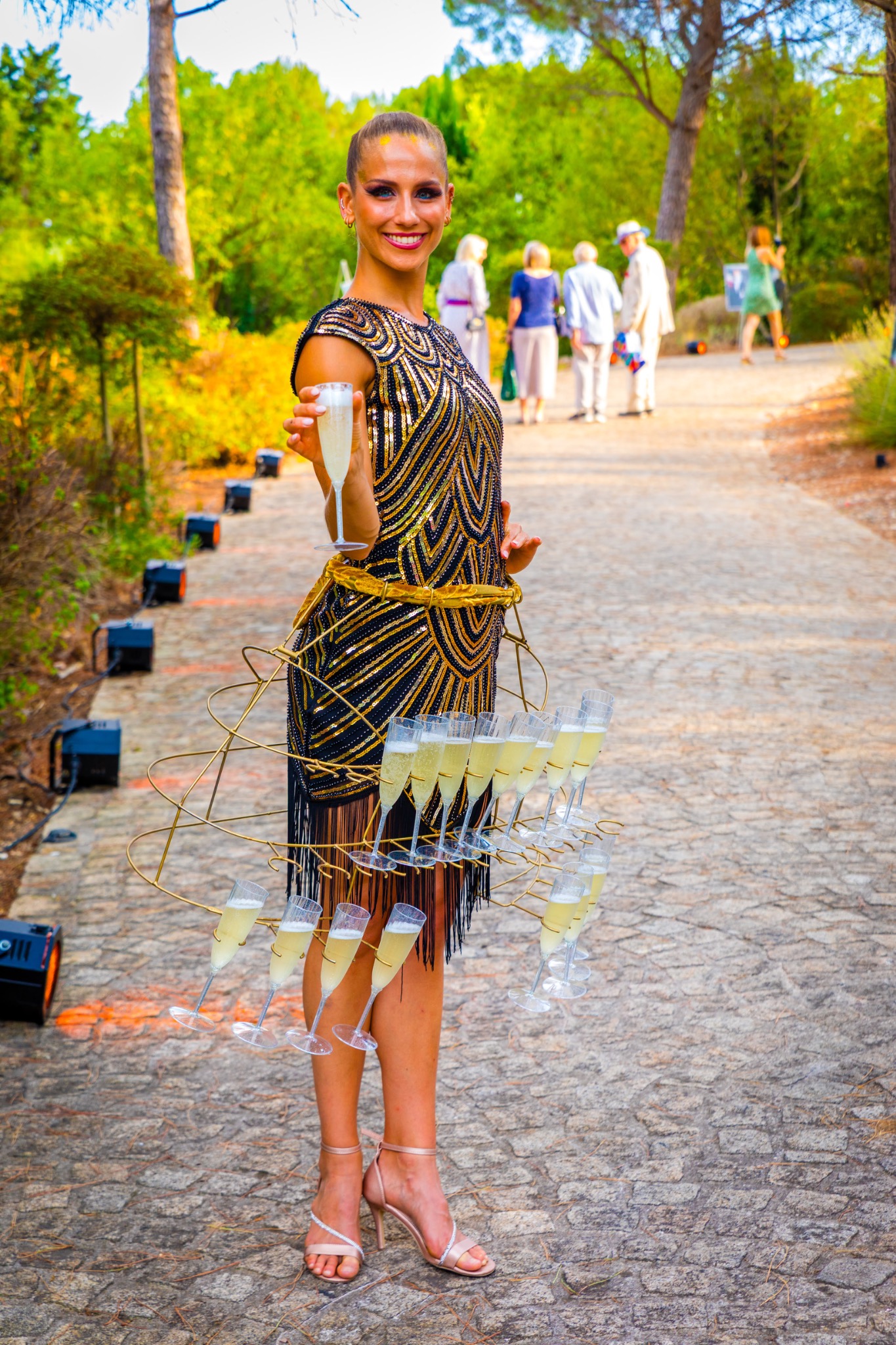 Colourfully dressed performer welcoming guests
