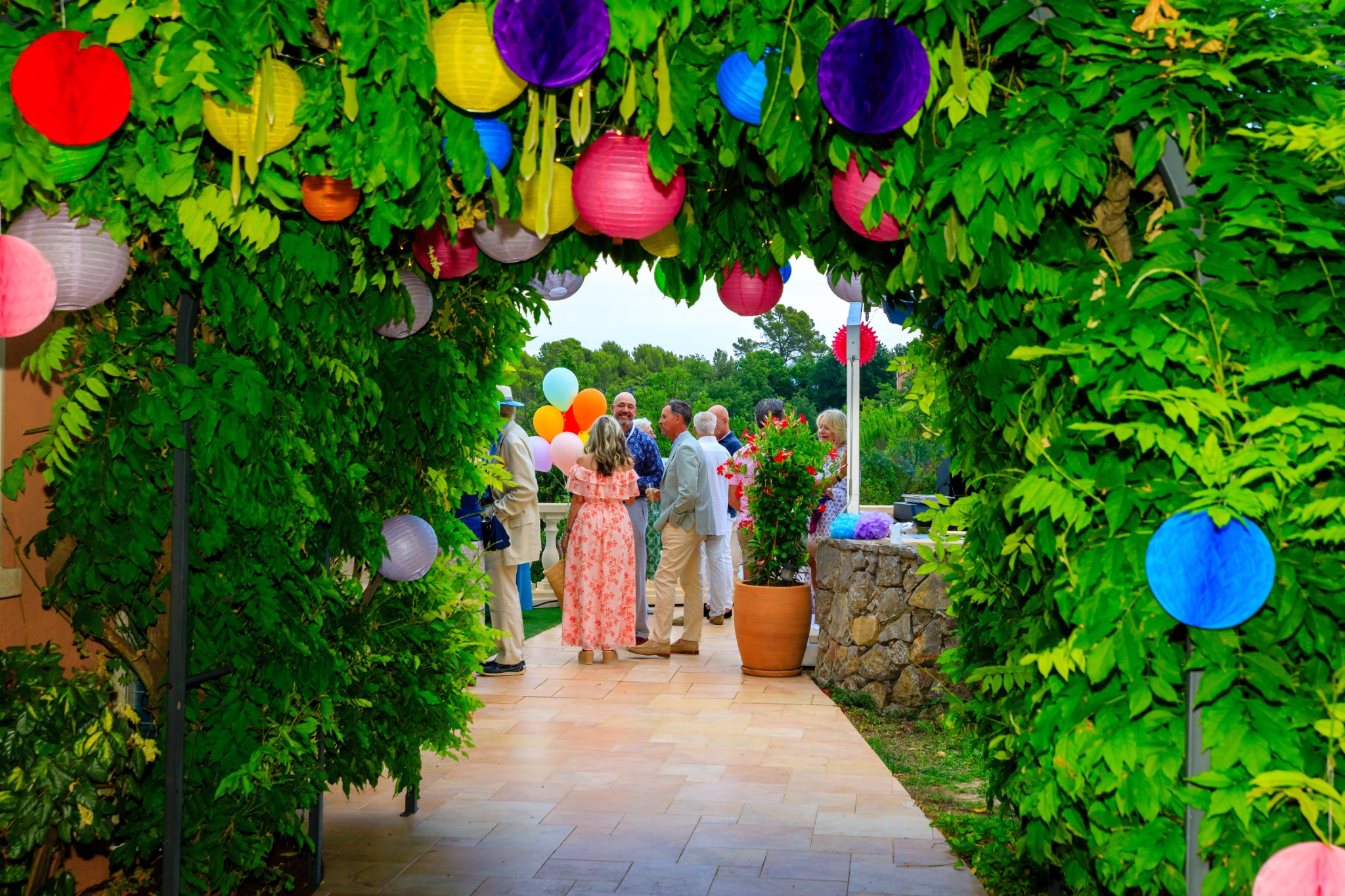 Colourful garden entrance welcoming guests to the celebration