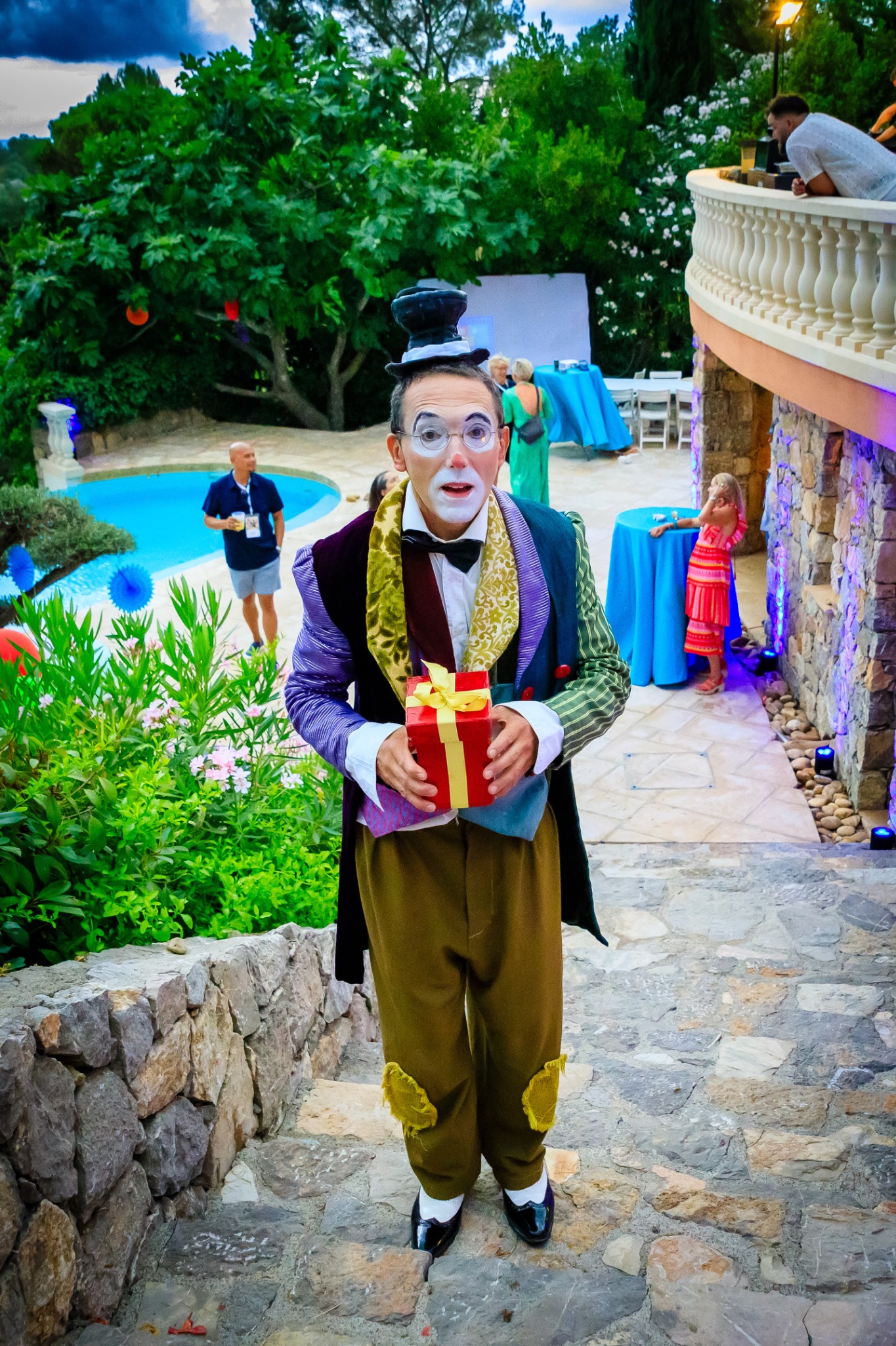 Playful entertainer surprising party guests