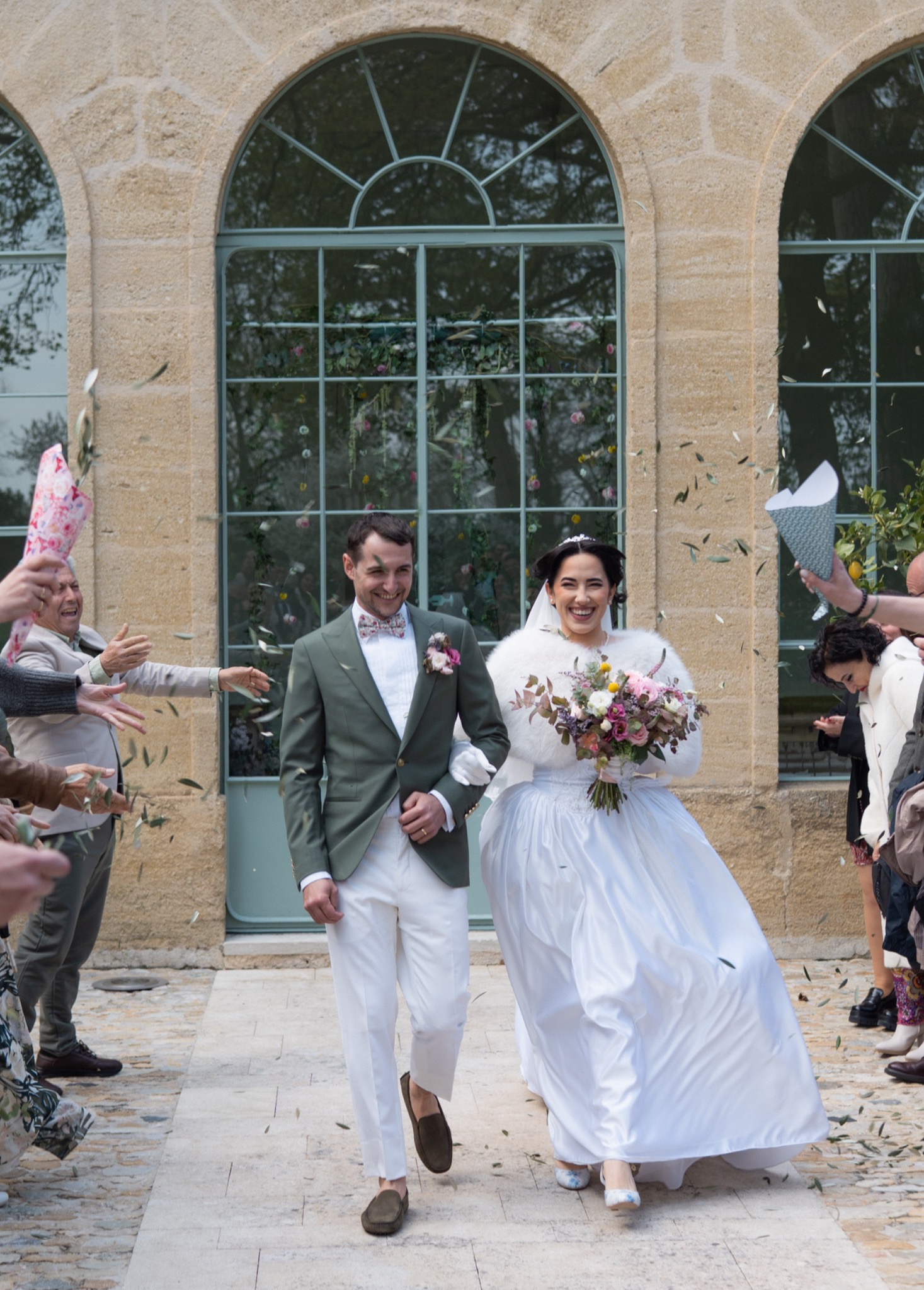 Newly married couple walking out together