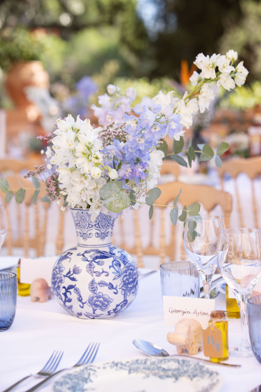 Elegant blue and white place setting at a wedding reception