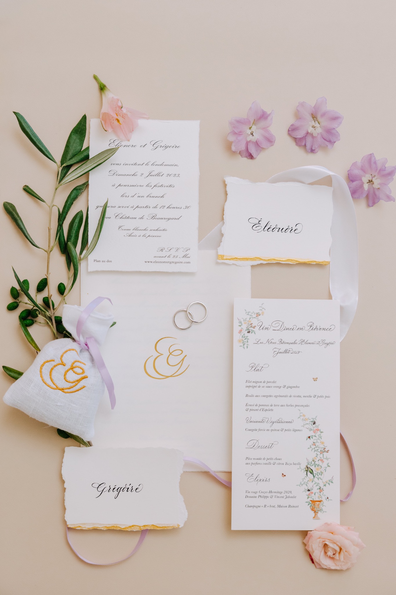 Wedding stationery and invitations arranged with flowers
